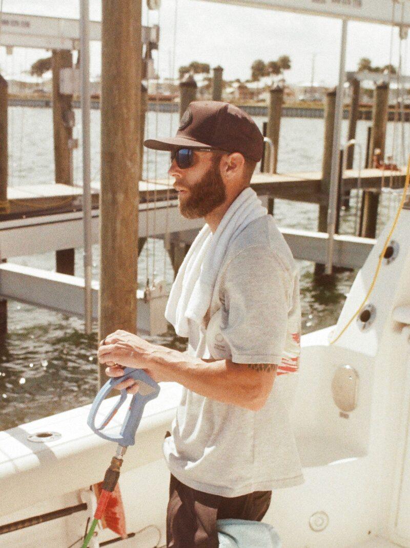 Brian detailing a boat inside a dry-stack storage facility in Jupiter, Florida